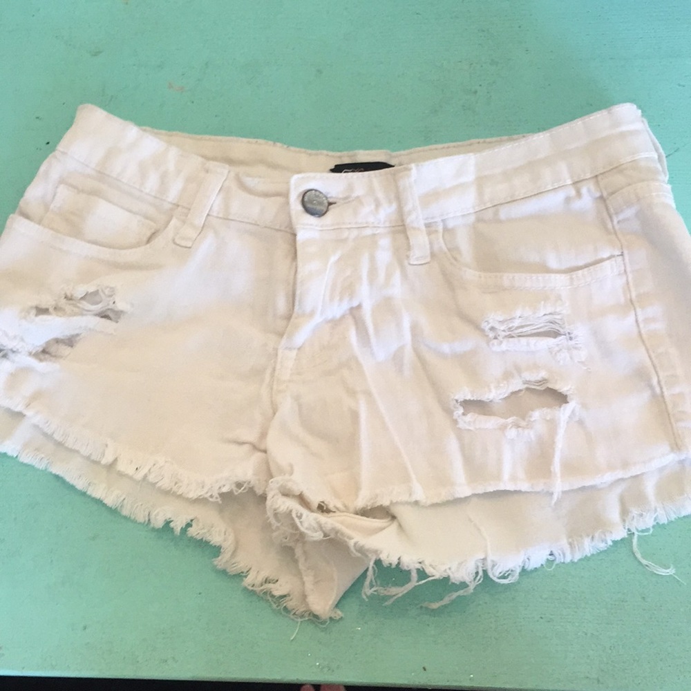 White ripped jean shorts